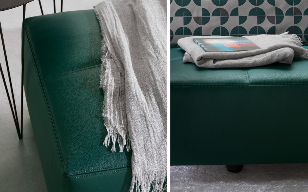 Closeup of Softbench one hundred fifty green wide square modular sofa in a living room.