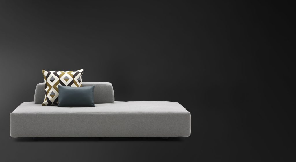 Softbench one hundred fifty two gray wide square modular sofa on a black background.