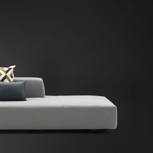 Softbench one hundred fifty two gray wide square modular sofa on a black background.