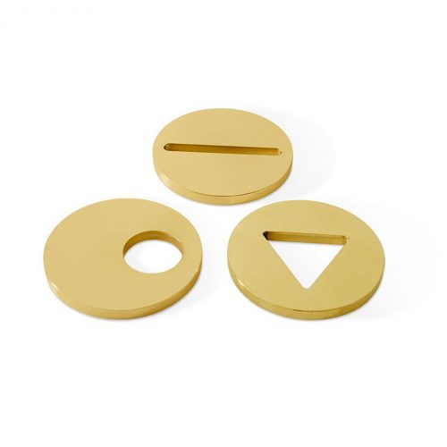 Three Paperweights in solid brass, one in circle, one in line and one in triangle shape on a white background.
