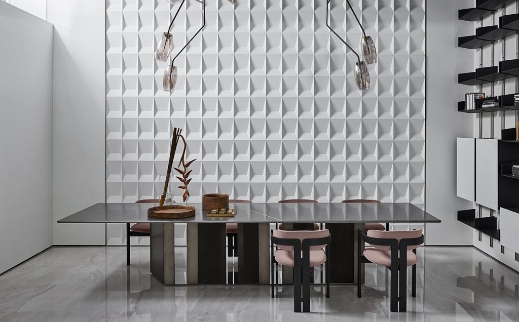 Large Platinium system table. Black rectangular shape with two legs in a dining room.