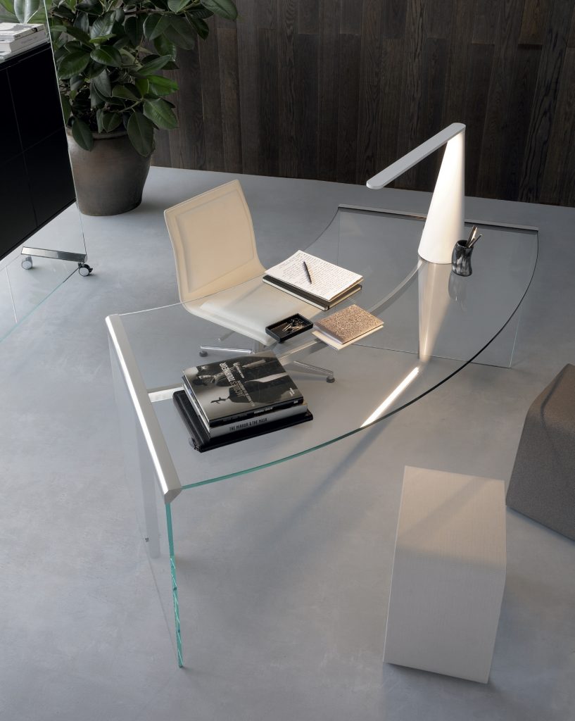 Rectangular President senior desk in transparent tempered glass ans silver steel in an office.