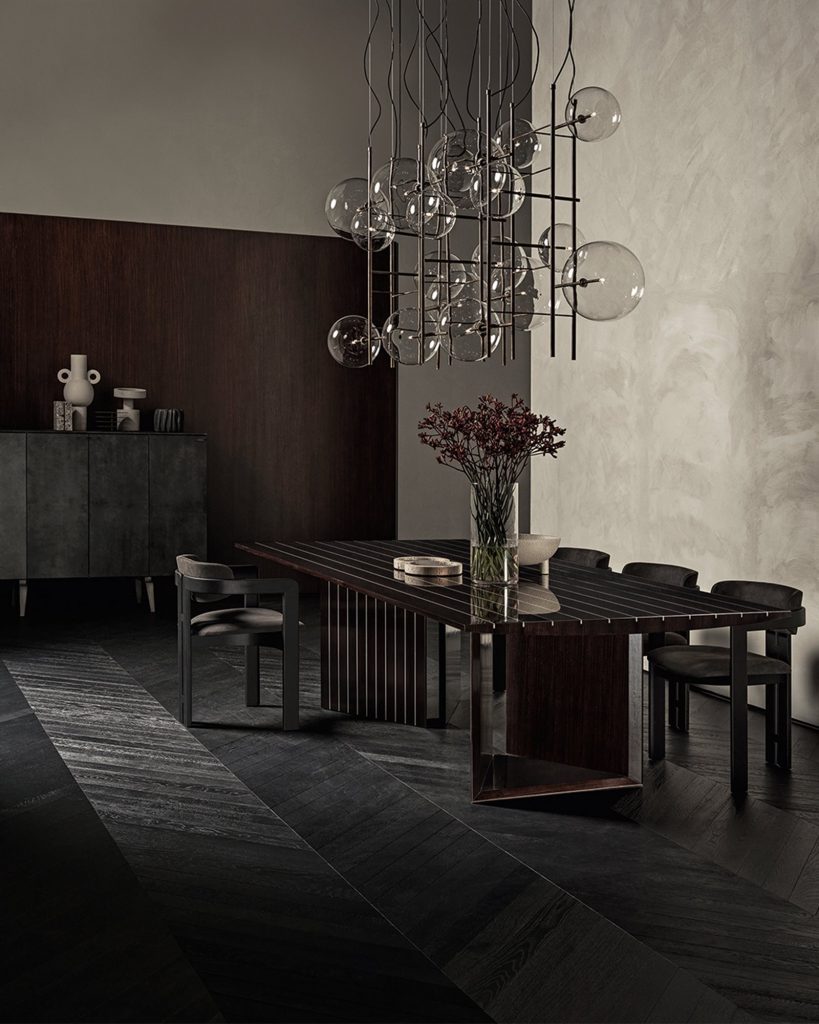 Prism rectangular dining tabe in brown wood with two legs in a dining room.