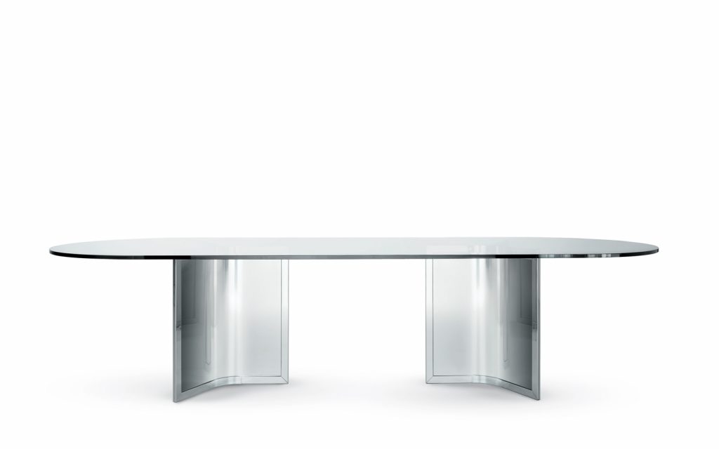 Raj / Raj Light Office: Large oval dining table with a glass top and silver metal frame on a white background.