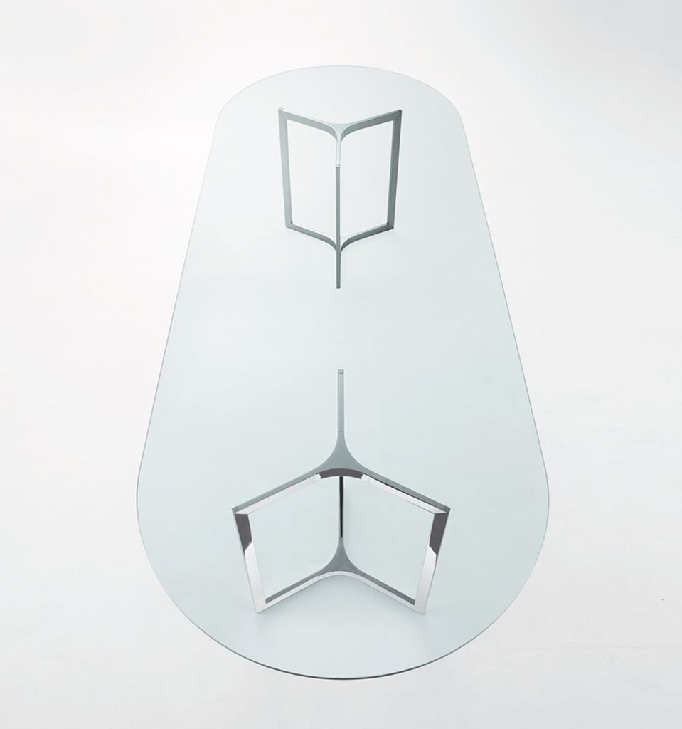 Raj / Raj Light Office: Large oval dining table with a glass top and silver metal frame on a white background.
