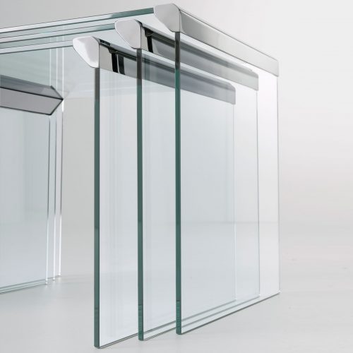 T35Trio: Three clear glass rectangle coffee tables with metal borders on a white background.