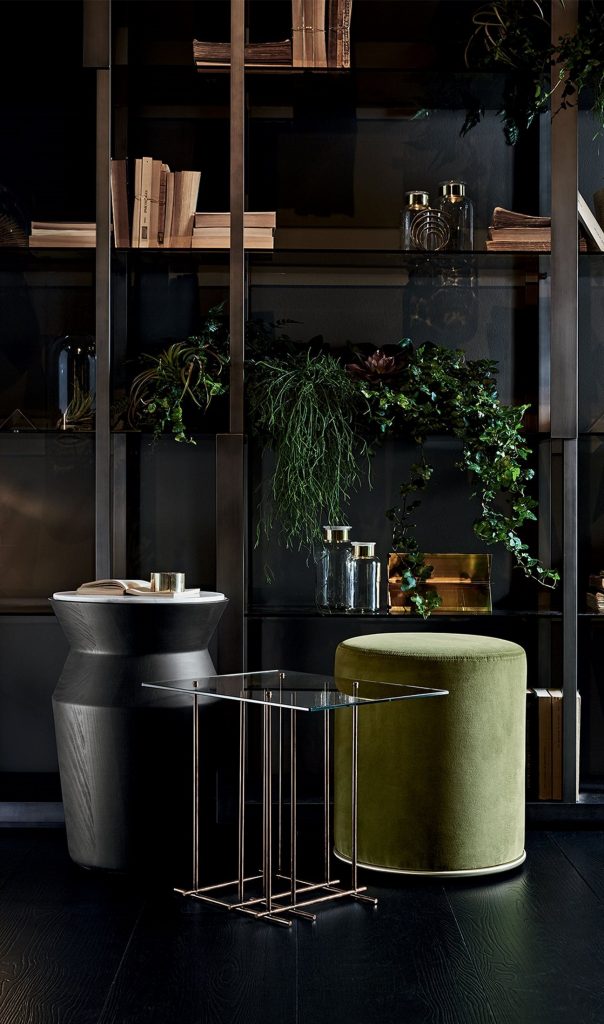 Tetris: Rectangle glass-top coffee table with bronze metal frame and cubic shapes in a living room.