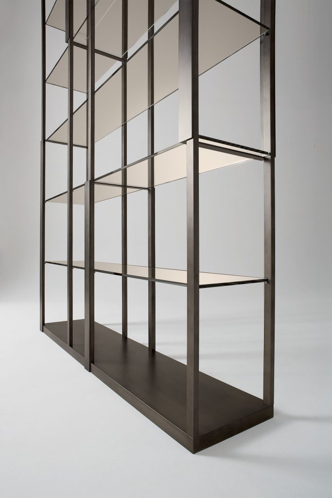 Tortona bookshelf with a modern design, featuring open shelving and a minimalist frame on a white background.