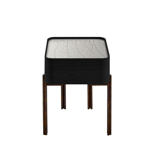 Twelve bedside table. Top in square shape in white cracket, black drawers and brown legs on a white background.