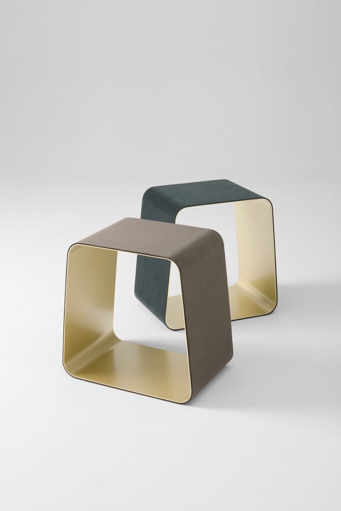 Two WGS stools with a rectangle shape. Internal part in bronze and external part one in brown and one in green on a white background.