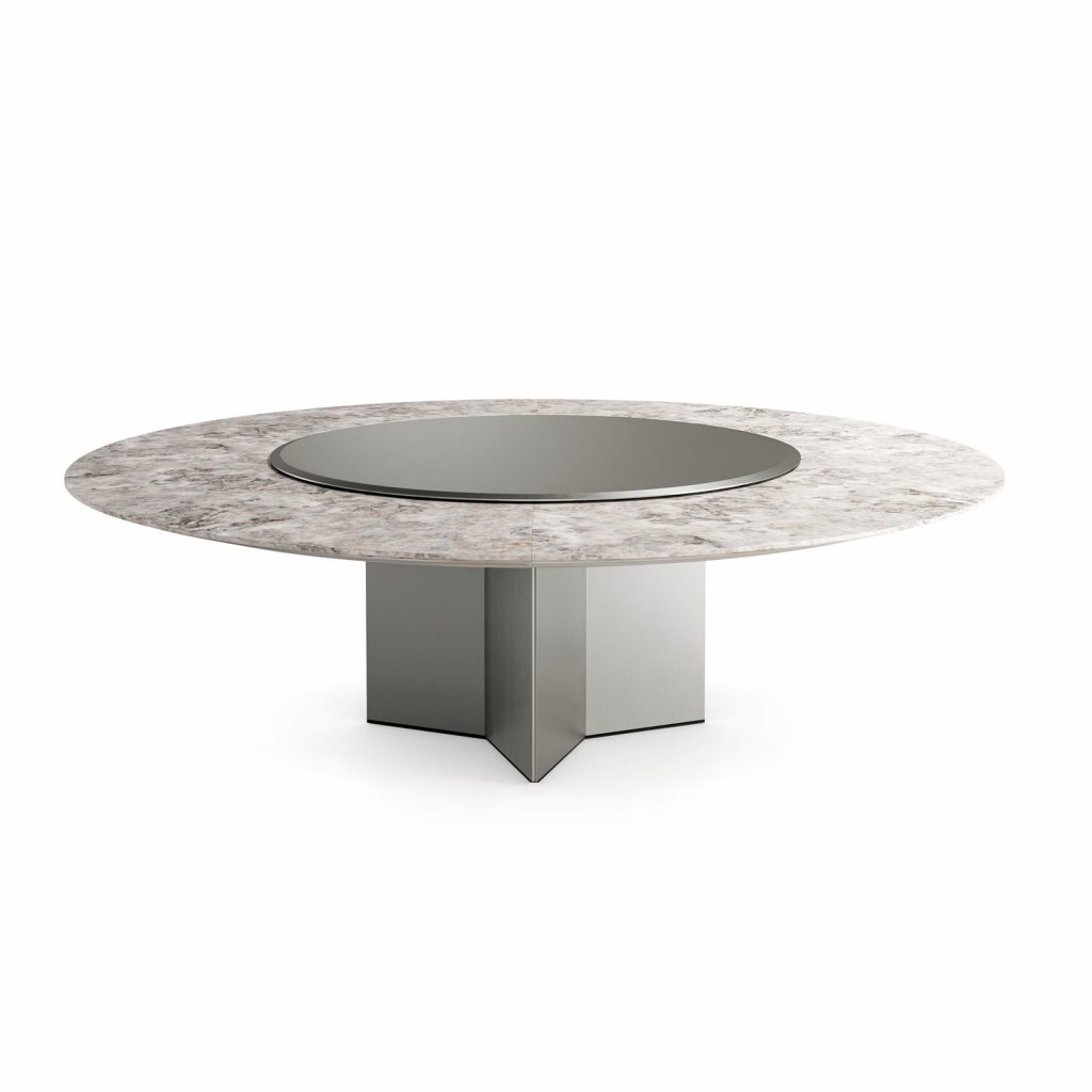 Yol Sect table, Round top in white and brown marble and silver central circle. Central leg in gray on a white background.