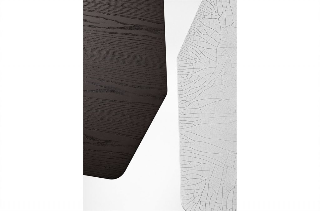 Closeup of Two Zen Coffee Tables with a polygonal top, one in white and one in brown on a white background.
