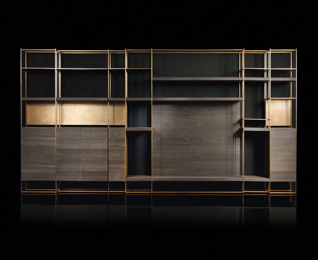 Cage C shelves with wood drawer and finish in brass on a black background.