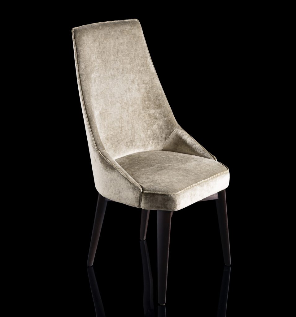 Is A Chair in gray fabric with for legs in black eucalyptus wood on a black background.