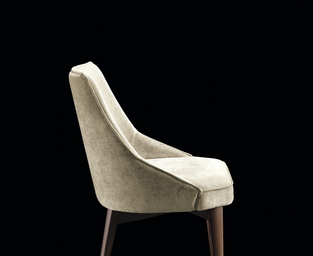 Is A Chair in gray fabric with for legs in black eucalyptus wood on a black background.