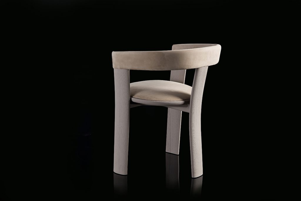 Beige Noce Chair, structure and three legs in wood. Padded seat and backrest with leather on a black background.