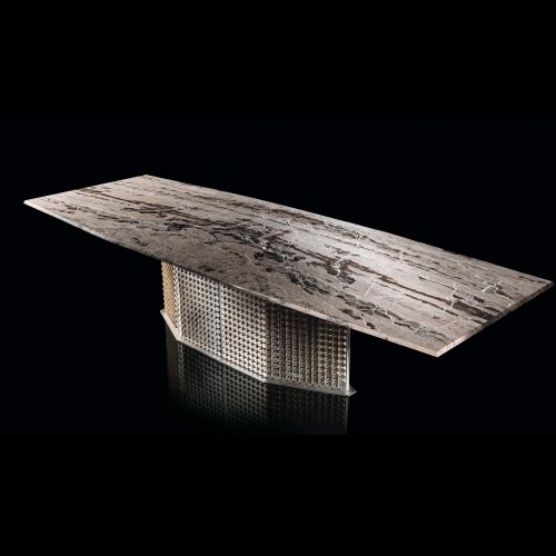 S-Penny Table, central legs structure of silver on brass creating a rhombus pattern, top in grey, black and white stone on a black background.