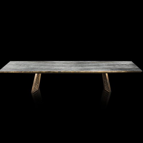 Stealth Table, legs in brass finish with rhombus pattern, top in gray grained wood stone on a black background.