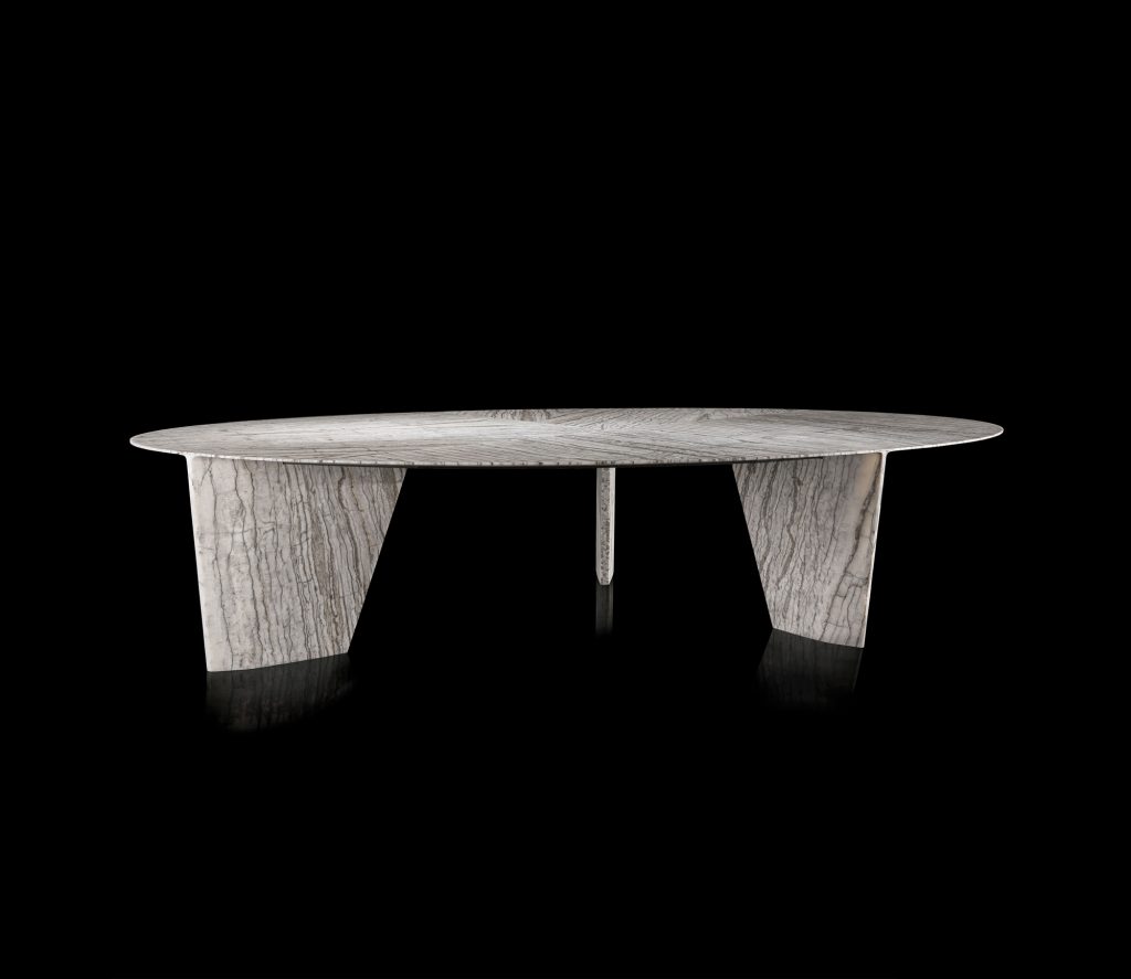 Round Synapses Table with three legs, white and black marble lines on a black background.