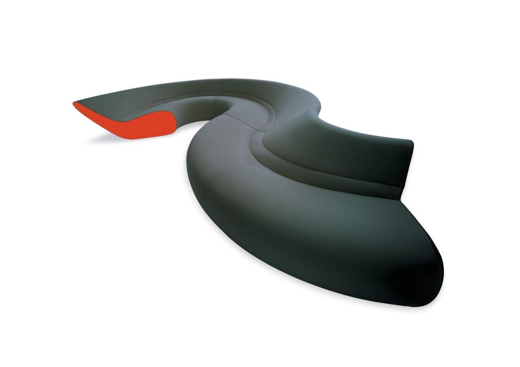Circle sofa with curved shape upholstered in gray and orange on a white background.
