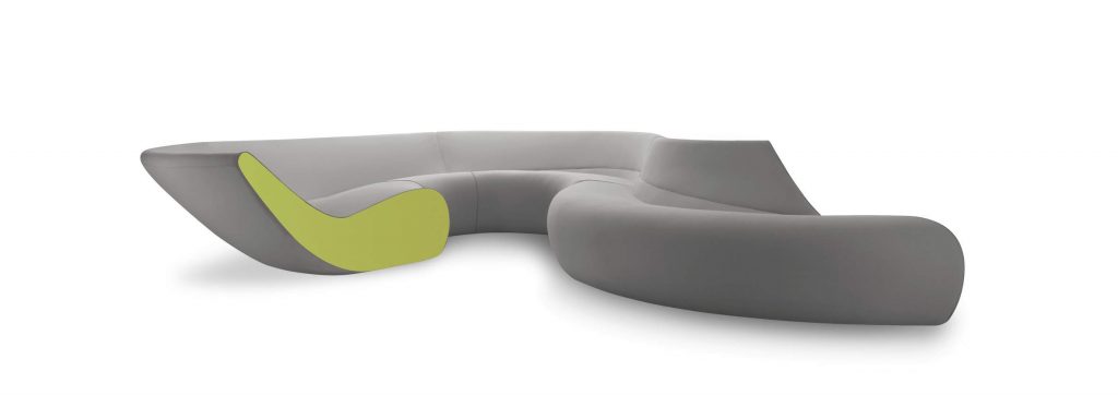 Circle sofa with curved shape upholstered in gray and green on a white background.