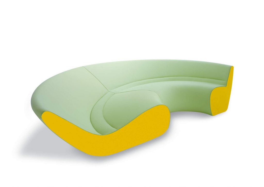 Circle sofa with curved shape upholstered in gray and yellow on a white background.
