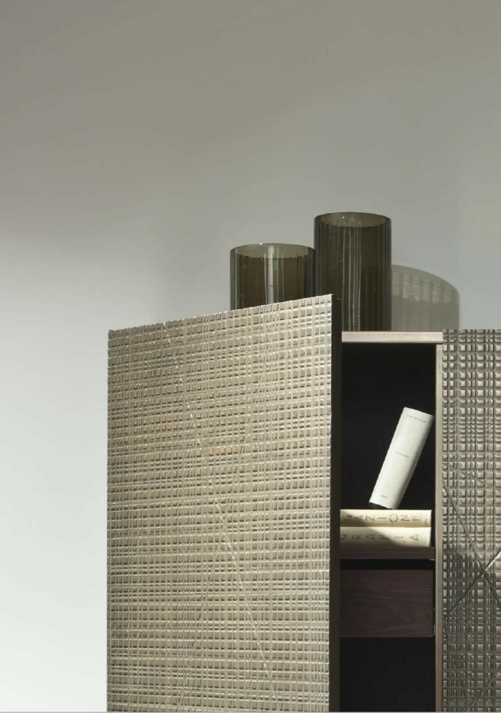 Liquid finish wood sample in brown and gold color with corrugated pattern, on a drawer unit.