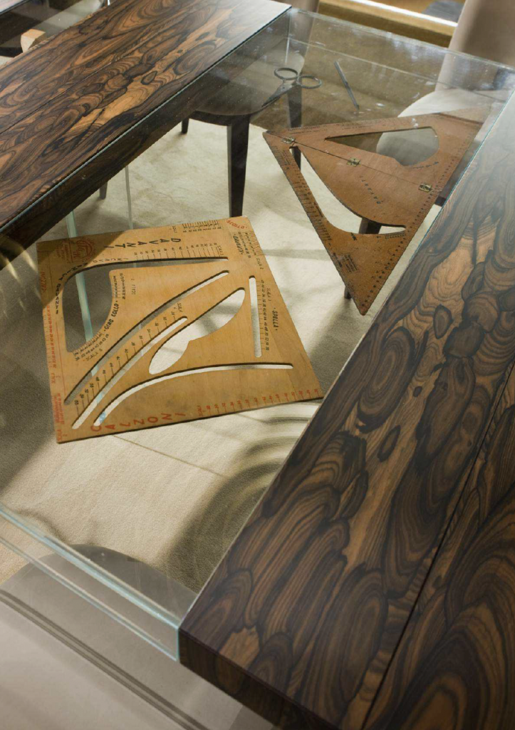 Special finish wood sample in a dark brown color with intricate designs and textures, set against a white background.