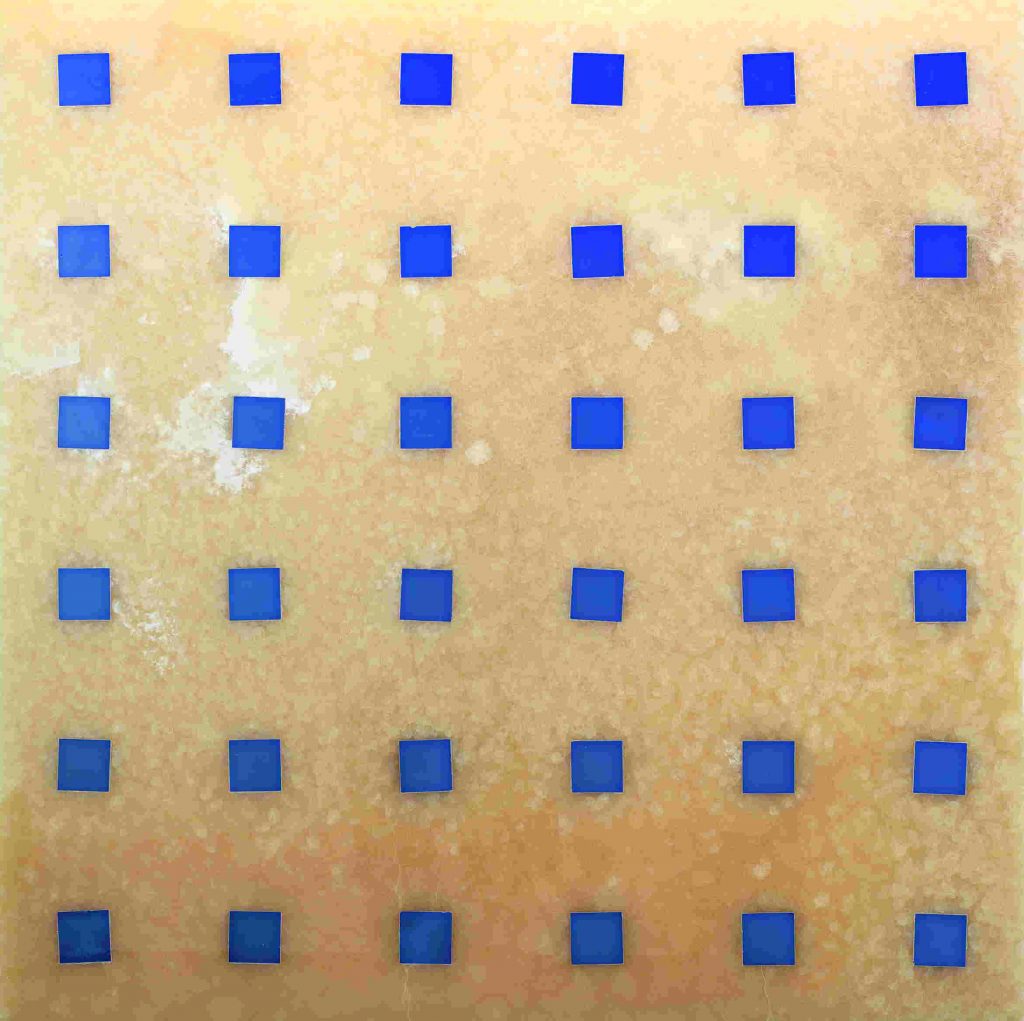 Ducale Carre finish mosaic in orange with blue square patterns.