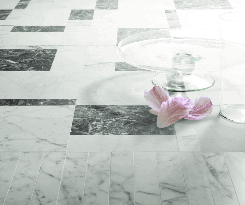 Rectangular Hana finish mosaic in white and black marble on the floor.