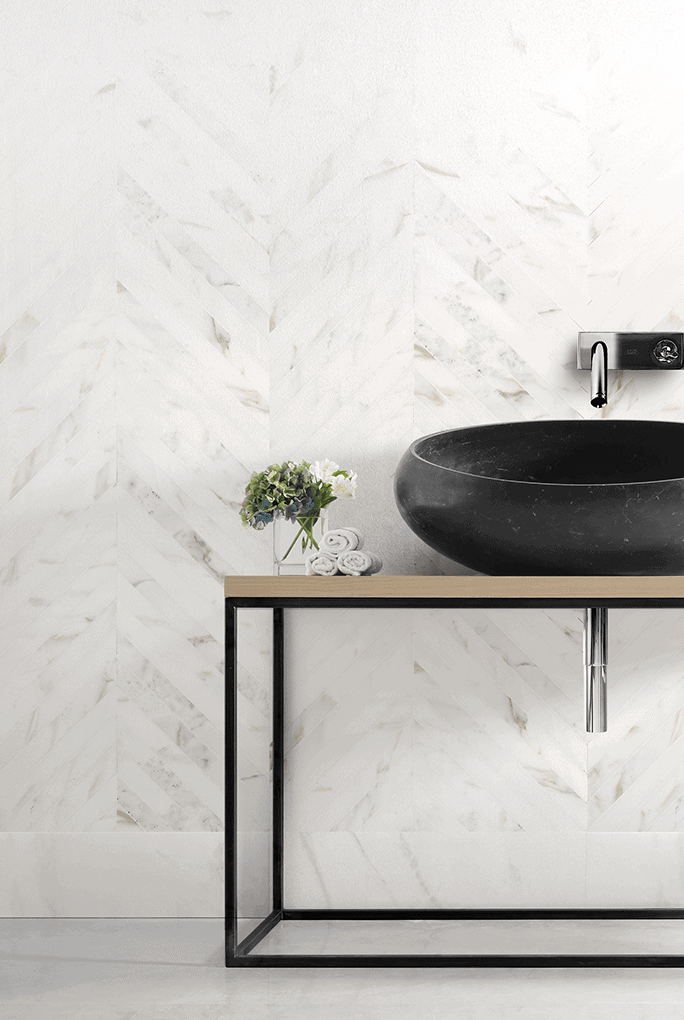 Rectangular Hana finish mosaic in white and black marble on a wall.