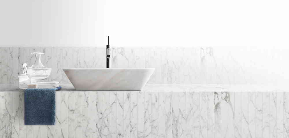 Rectangular Hana finish mosaic in white and black marble on a wall.