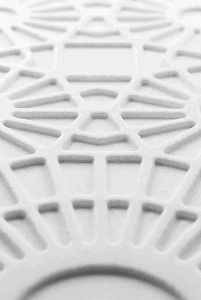 Merletto finish mosaic in white with lace-like patterns.