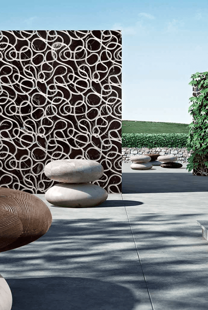 Picto finish mosaic in beige and brown with pictographic patterns on the wall of a terrace.