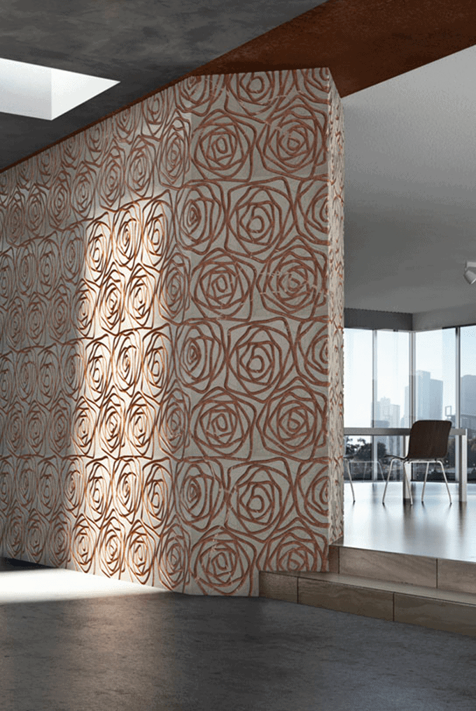 Rose finish marble sample in white and orange color with rose patterns, on a wall.