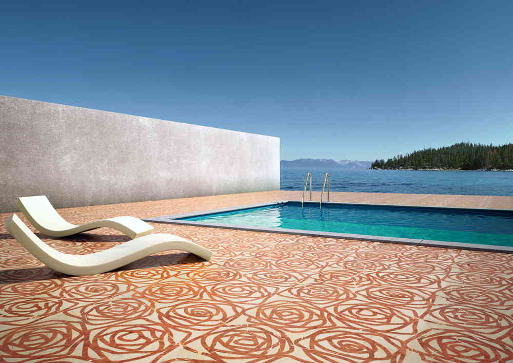 Rose finish marble sample in white and orange color with rose patterns, on the floor of a pool space.