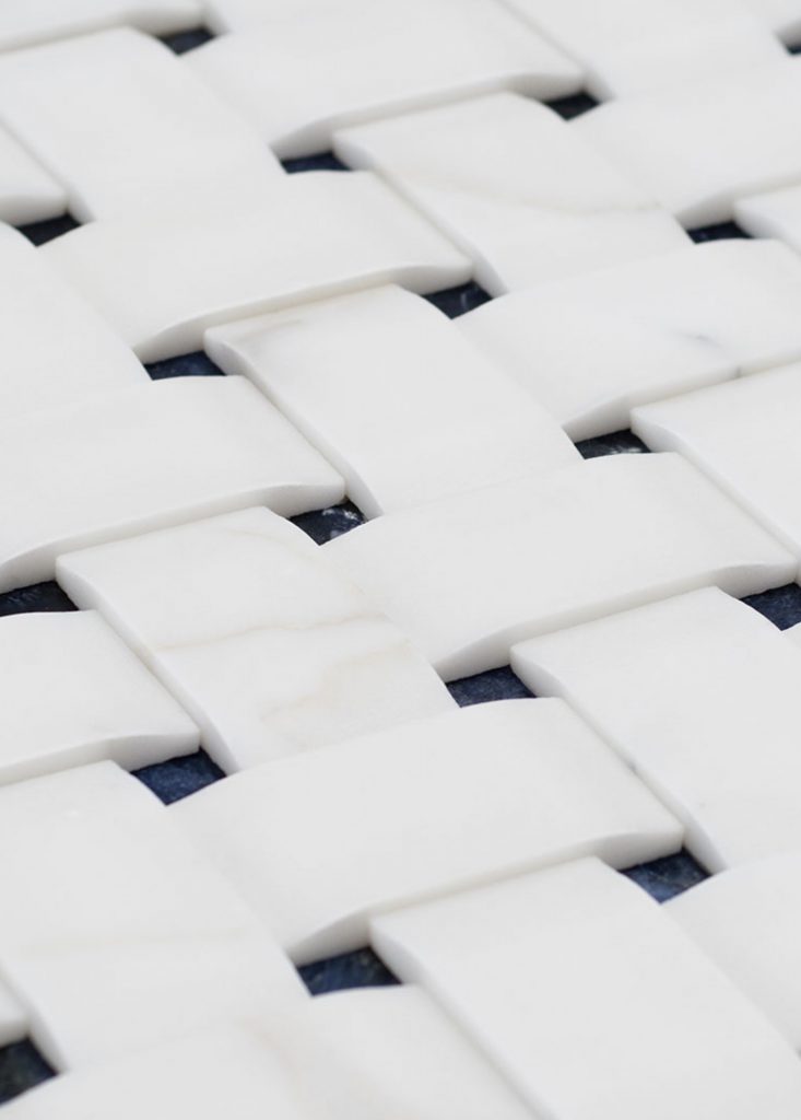 White Texo finish marble with woven patterns.