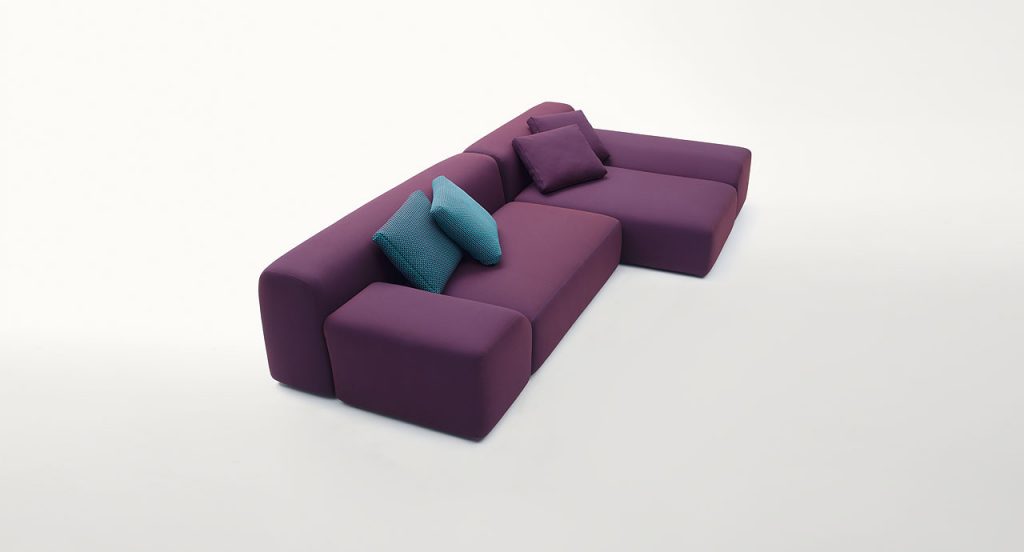 All Time Series composed of large sectional seating elements, upholstered in burgundy fabric on a white background.