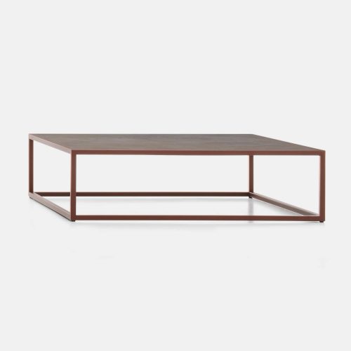 Arpa Low Table, Loadbearing structure in stainless steel, corten in ceramic top, structure in matt corten goffered on a white background.