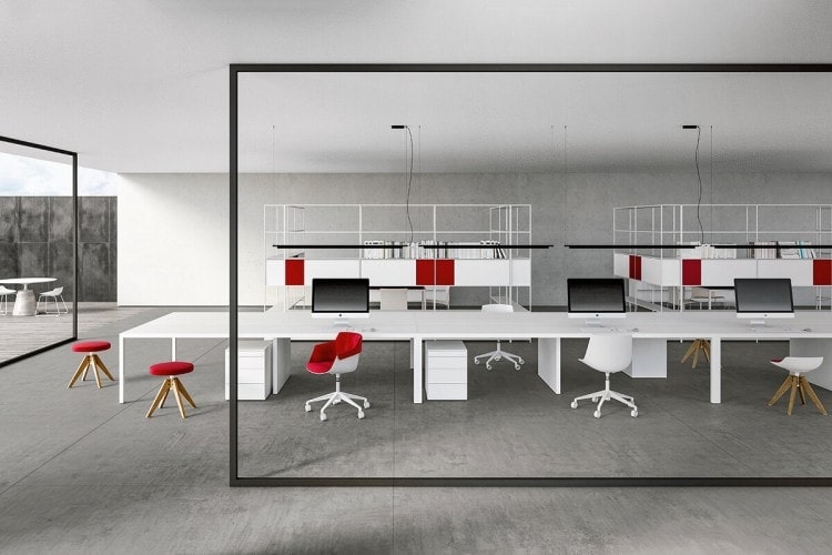 Three white Desk 3.0. Large rectangular shaped top with five legs in steel and three white steel office cabinets with three stationary drawers on a office.