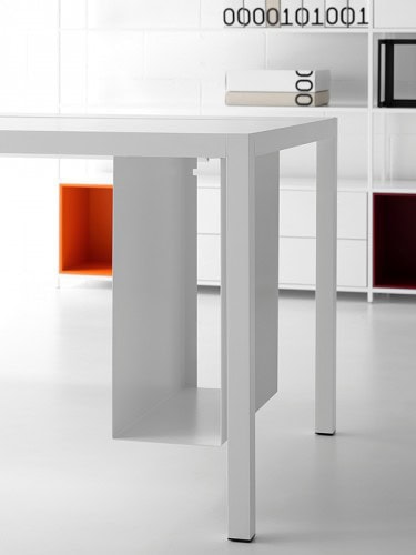 A white steel PC holder Desk 3.0 on a desk in a office.