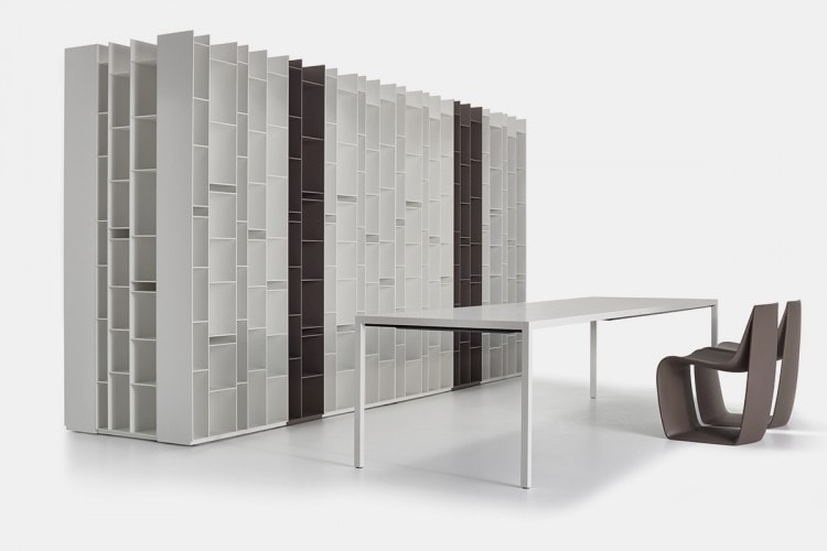 A Extension table, the laminate tabletops and extension tops in Fenix are built-in and are reinforced internally by thick aluminium sheets with four legs in aluminium on a white background.