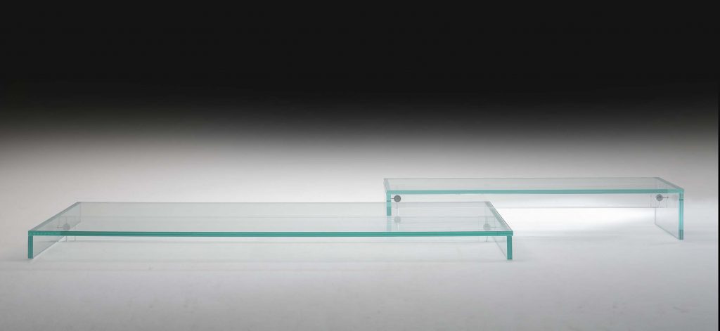 A modern Simplicity Bench crafted from transparent glass with a minimalist aesthetic, featuring clean lines and a seamless floating design for a sleek look