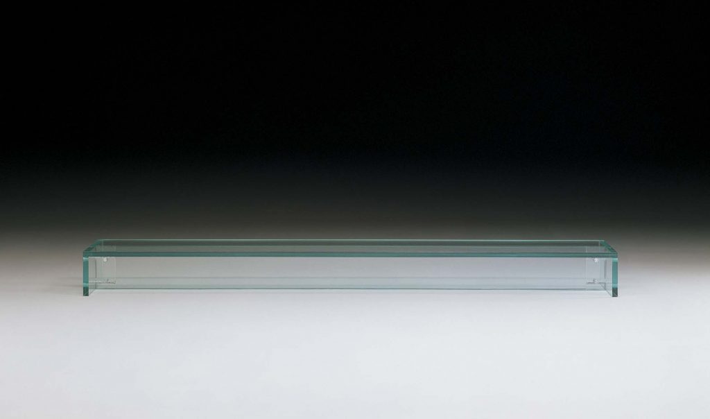 A sleek Simplicity Bench made entirely of transparent glass, featuring a minimalistic floating design with clean lines and a smooth, polished surface