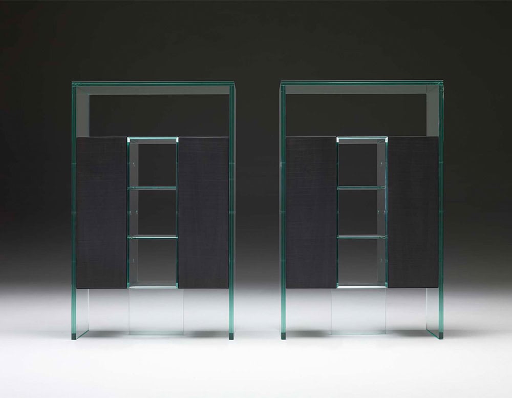 A pair of sleek, modern glass cabinets with dark interior shelving, showcasing a minimalist and contemporary design