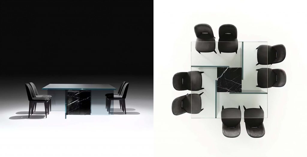 Simplicity Table features a sleek modern design with a reflective glass surface and a geometric metal base, paired with black upholstered chairs for contrast