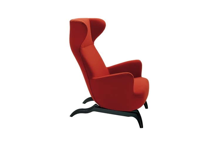 Ardea armchair with a red fabric upholstery and black wooden legs on a white background.