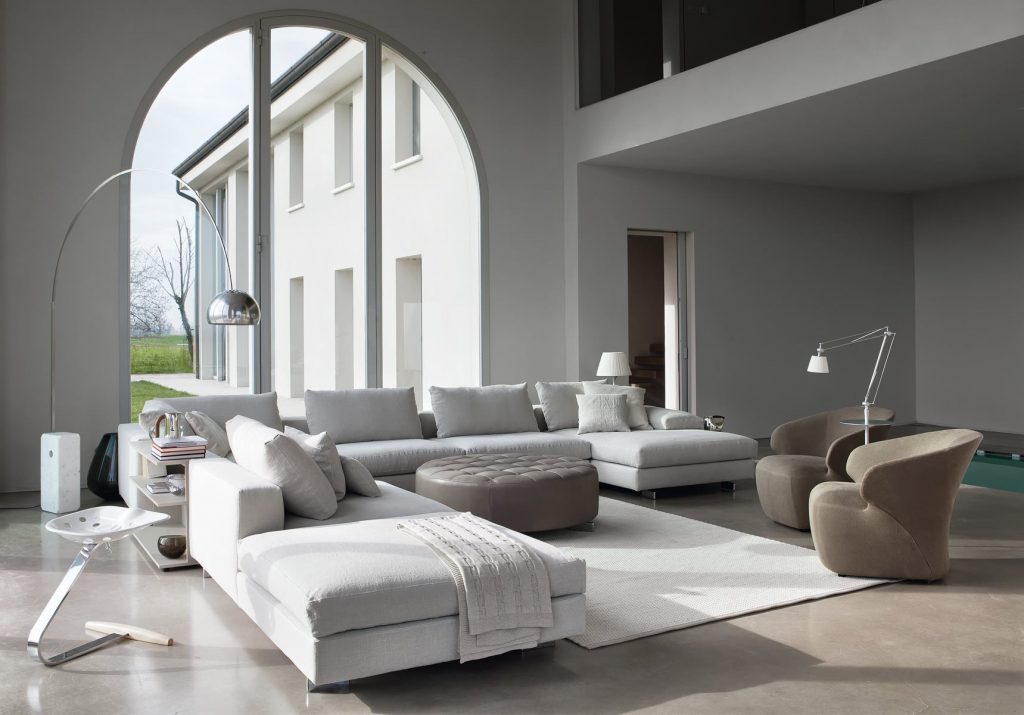 Arom armchair upholstered in gray fabric in a living room.