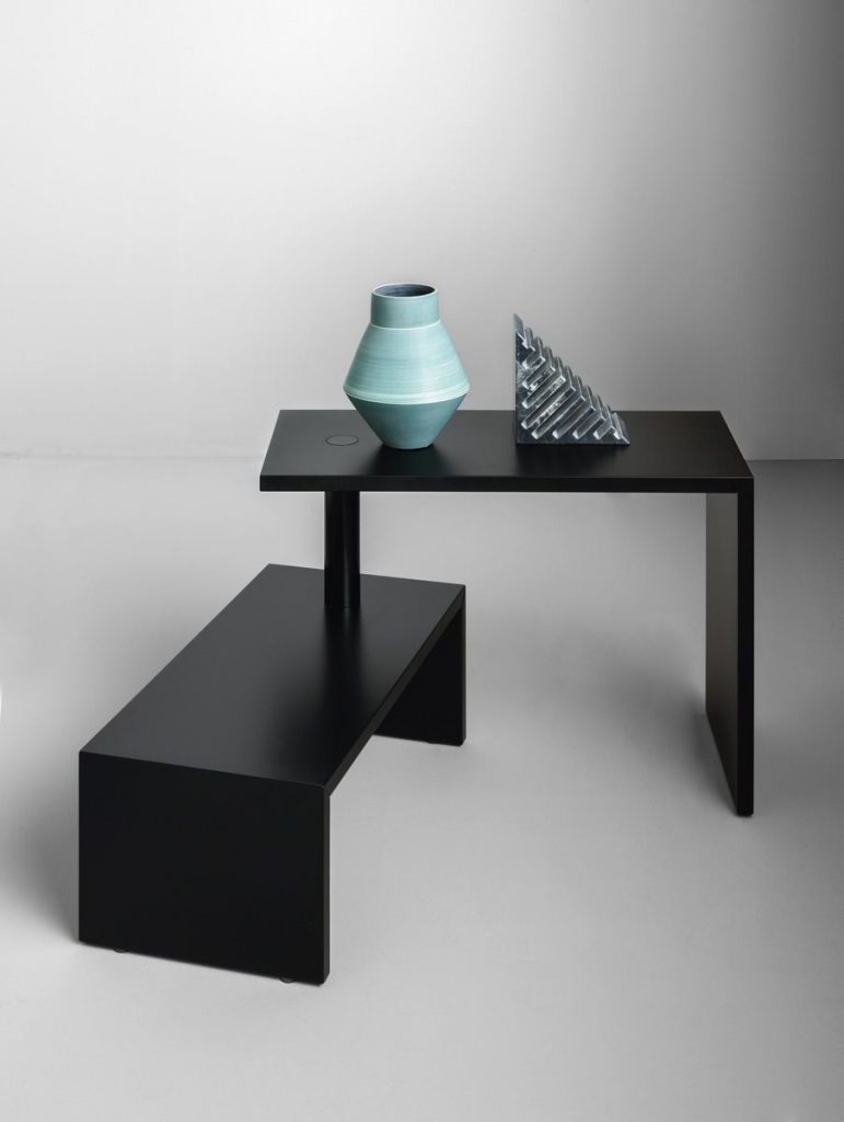 Black rectangle Basello side table. It consists of two tables joined by a round stick on a white background.