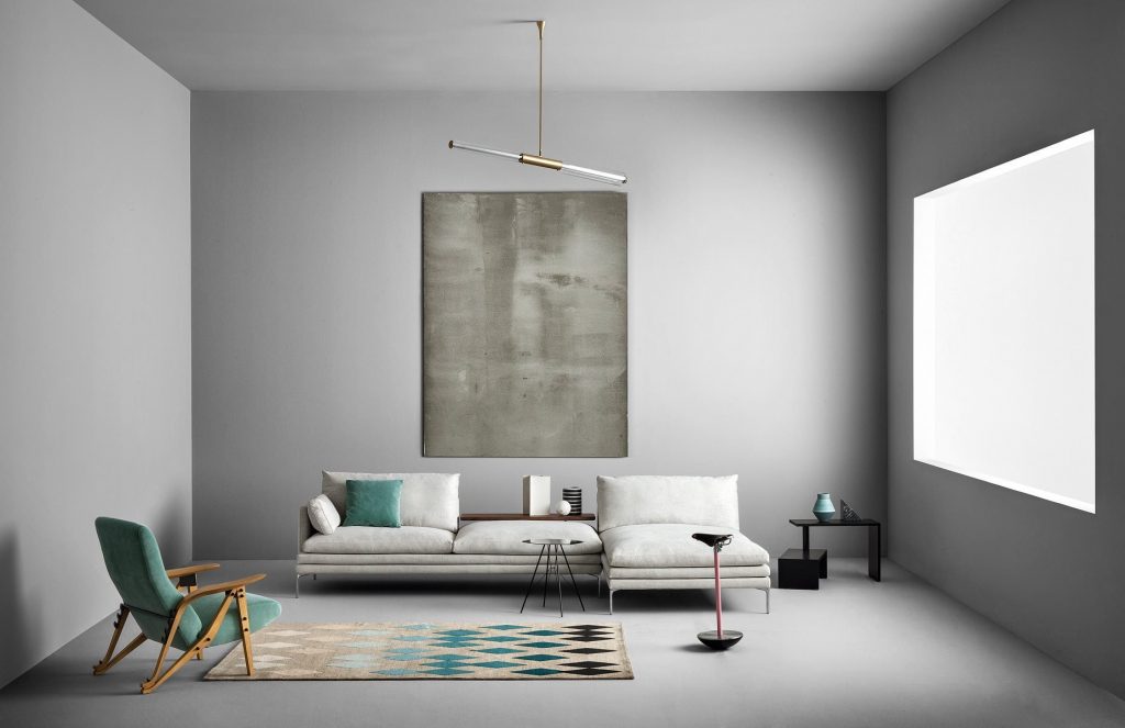 Black rectangle Basello side table. It consists of two tables joined by a round stick in a living room.